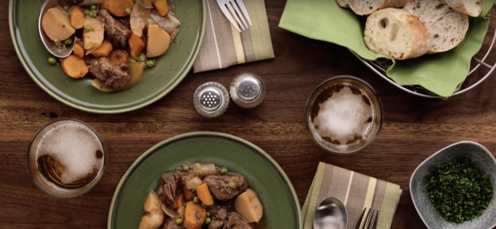 a table set with bowls of slow cooker hearty beef stew