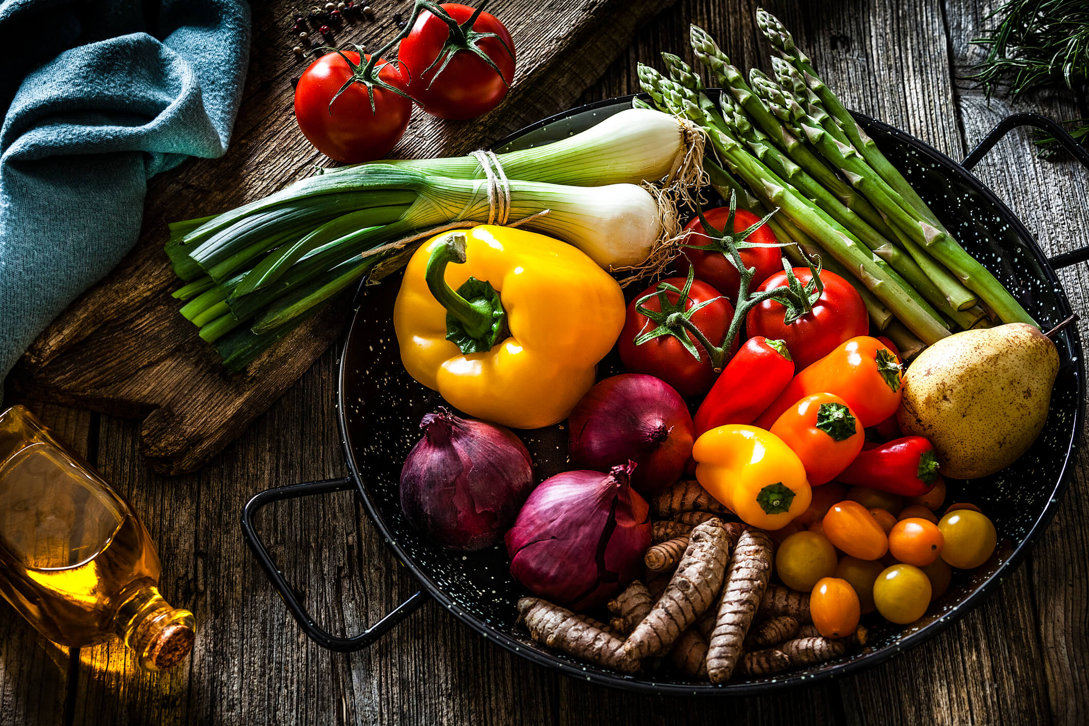 Vegetables are one type of organic food. Shown are peppers, asparagus, tomatoes, and onions