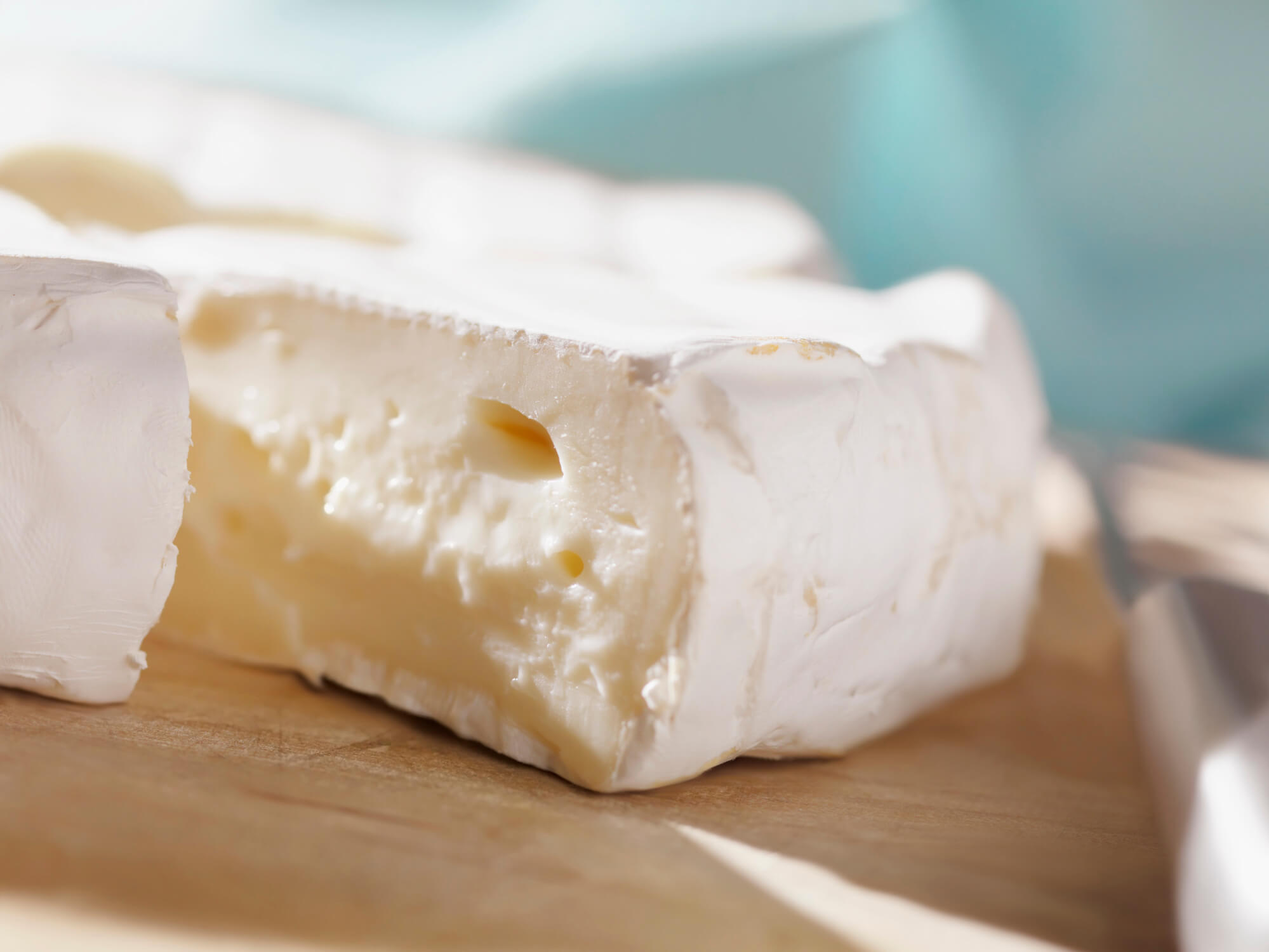 Brie is a creamy, delicious soft cheese to add to a cheese board.