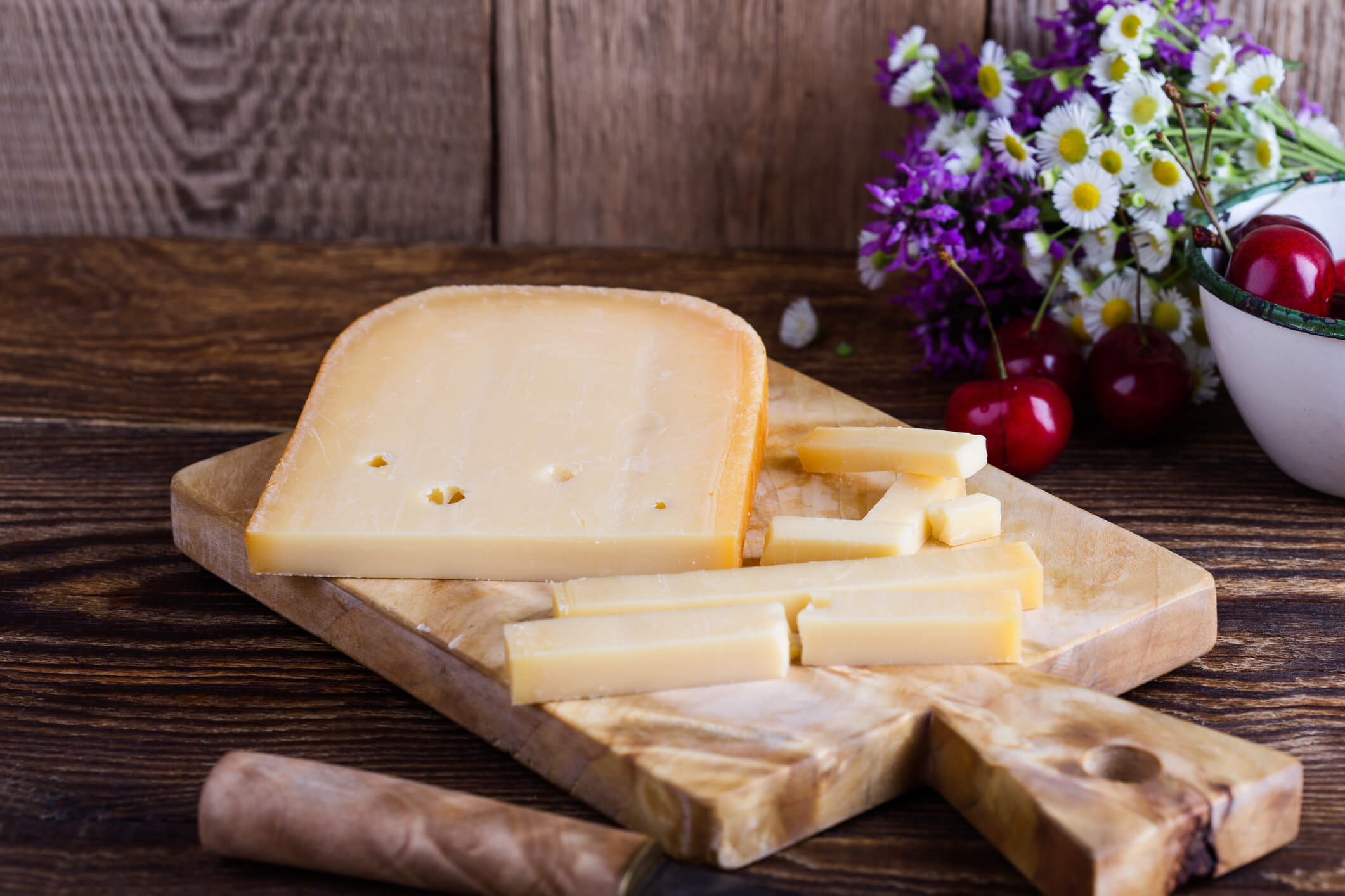 Semi-hard cheeses contain less moisture but add great flavor to a cheese board.