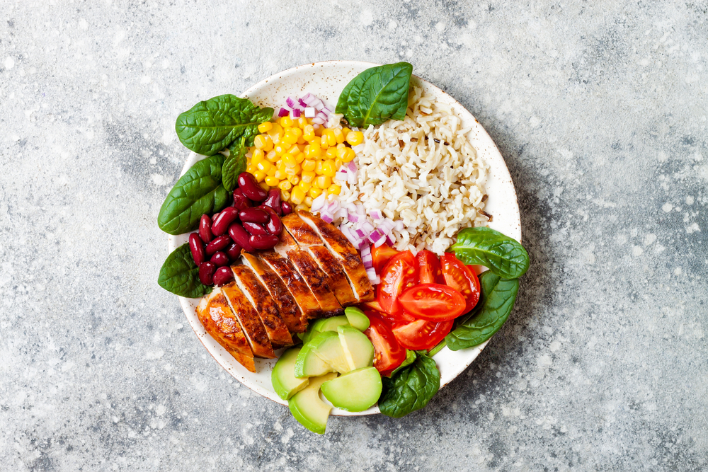 Build your own Southwestern bowl with grilled chicken, beans, corn, rice, tomatoes, and more.