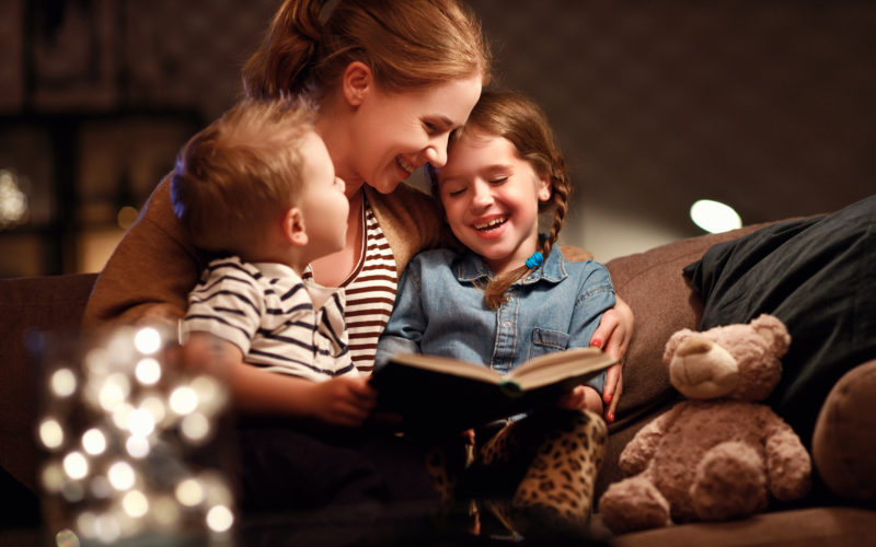 A family reads together on Christmas Eve