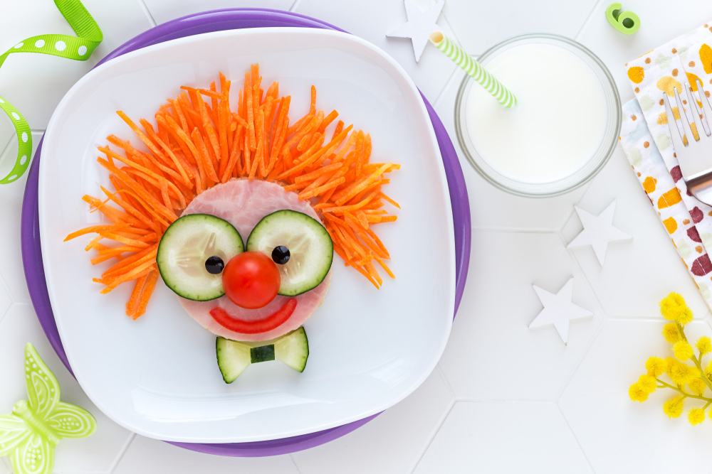 A face made out of vegetables for a kid's snack.