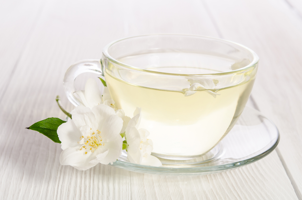 A clear mug of pale white tea