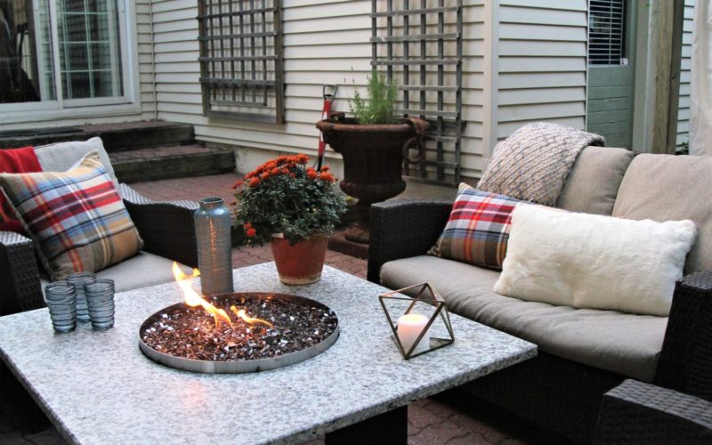 An outdoor entertainment area decked out for fall and winter hosting.