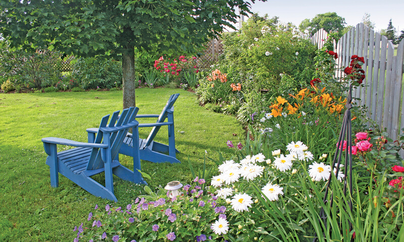 perennial garden and adirondack chair