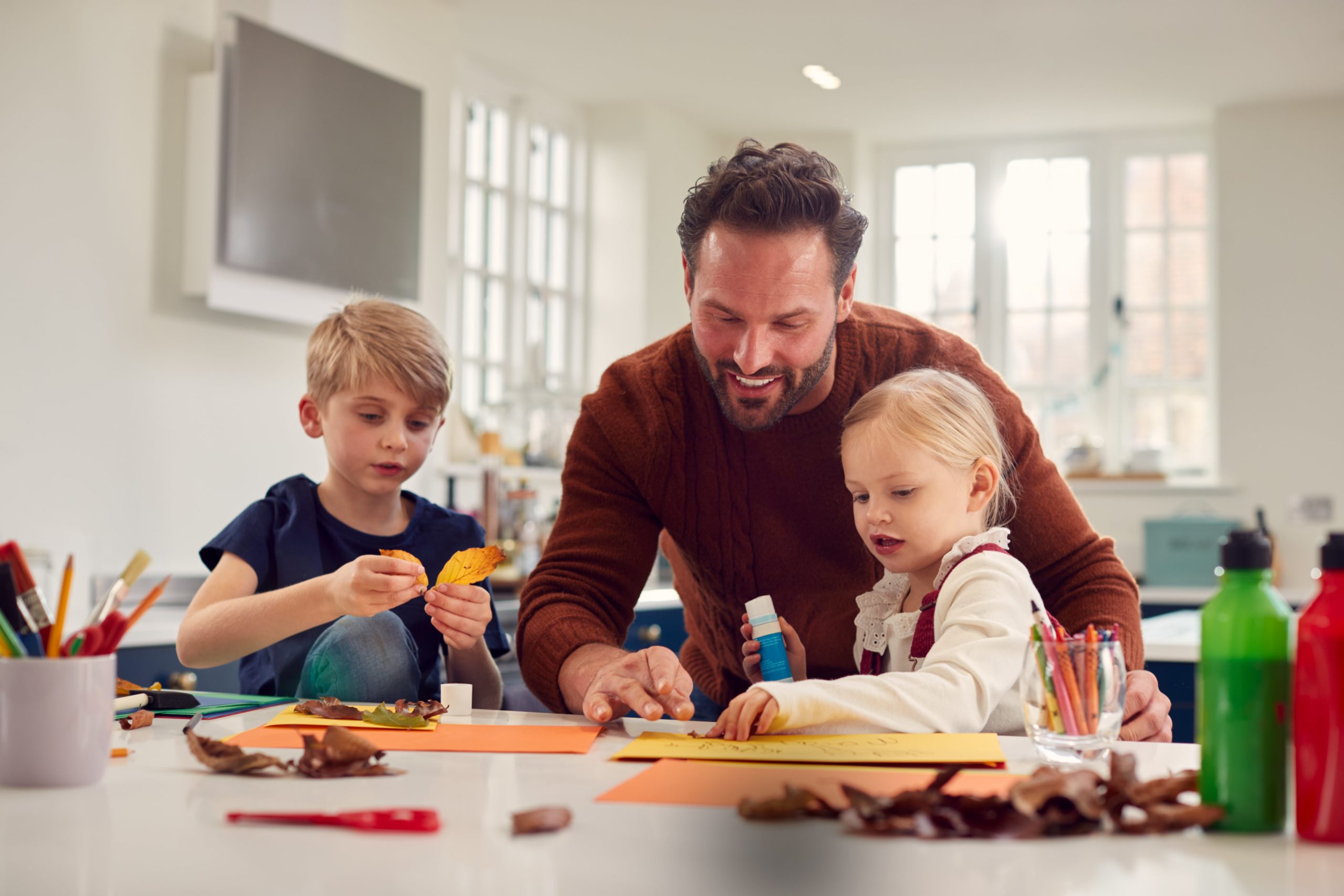 Father making crafts with his children