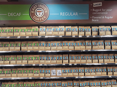 Bags of East Indies Coffee on the shelves at Stauffers of Kissel Hill