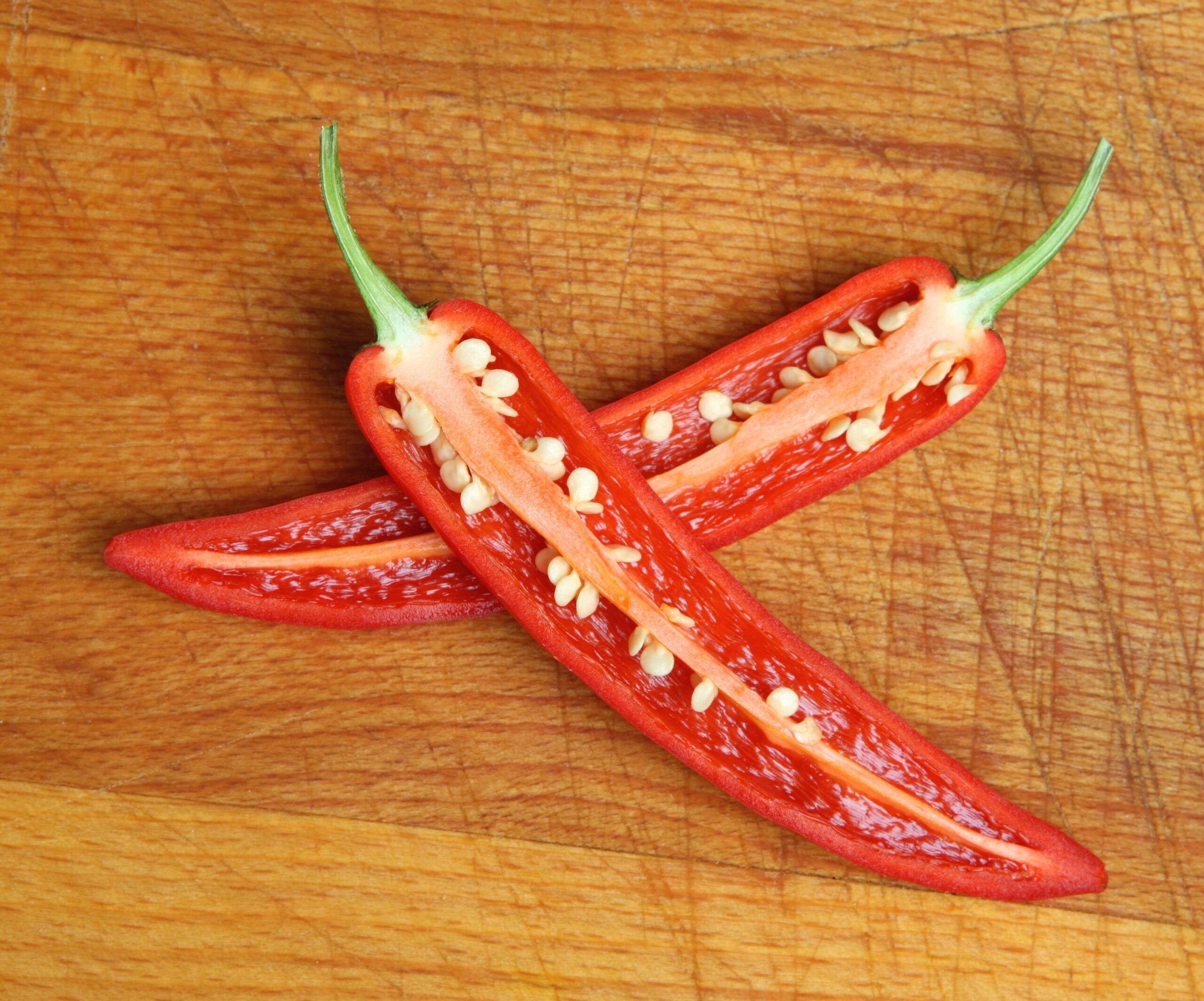 red chili pepper sliced open to show seeds