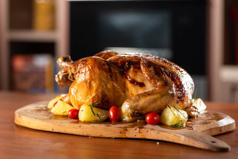 An easy Thanksgiving turkey on a wooden cutting board