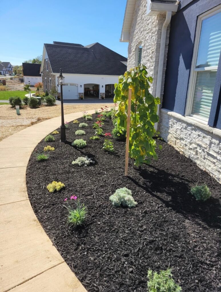 Mulch, flowers, and shrubs along a building in Lancaster, PA