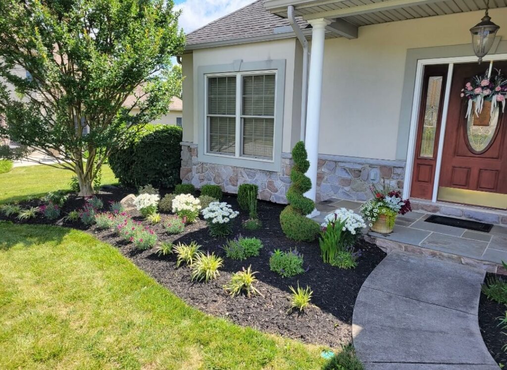 Landscaping in front of a home that used mulching services in Lititz, PA