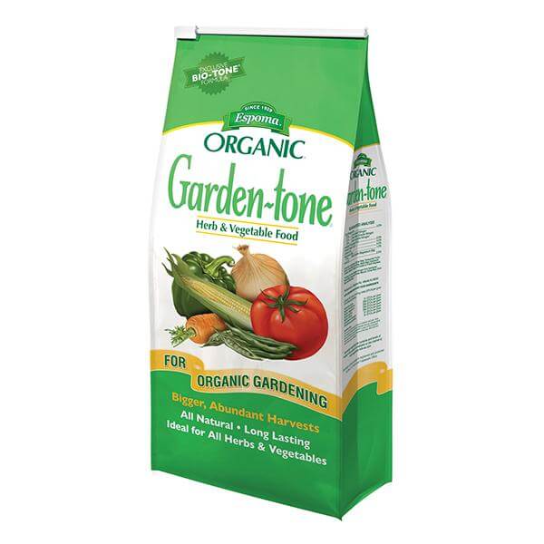 White and green bag of Espoma garden tone fall planting fertilizer